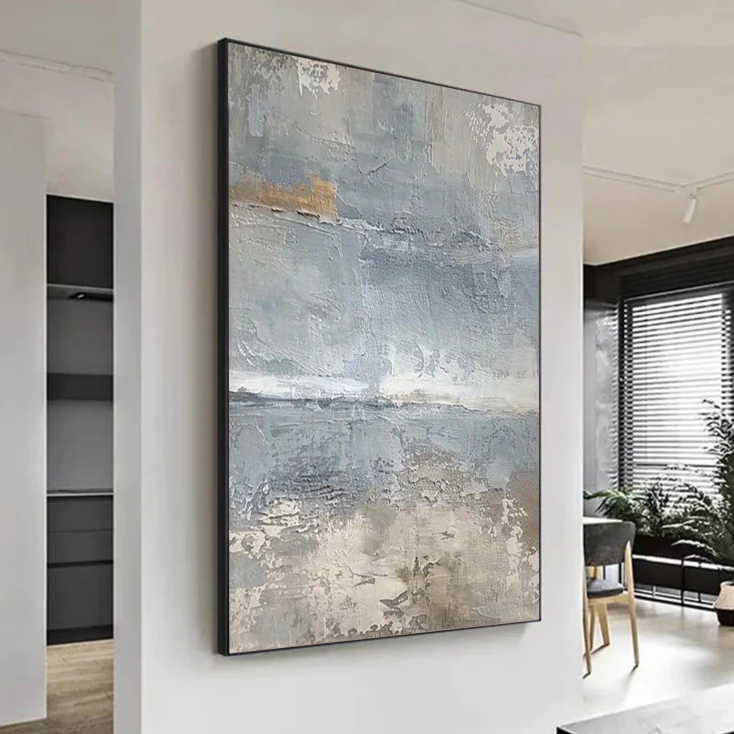 A black and white textured painting with raised strokes and shadow